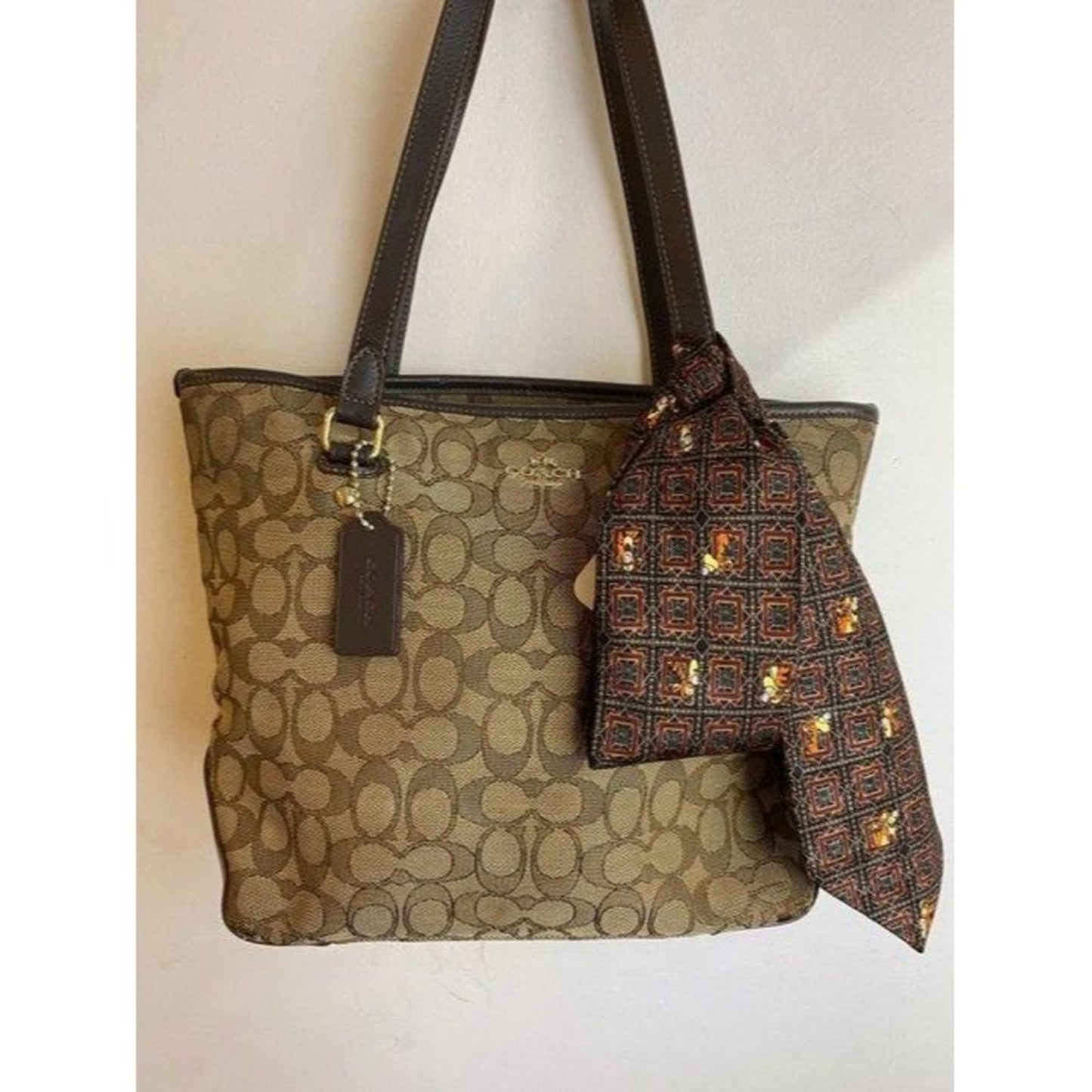 coach w all over logo w add on pooh beige brown ja