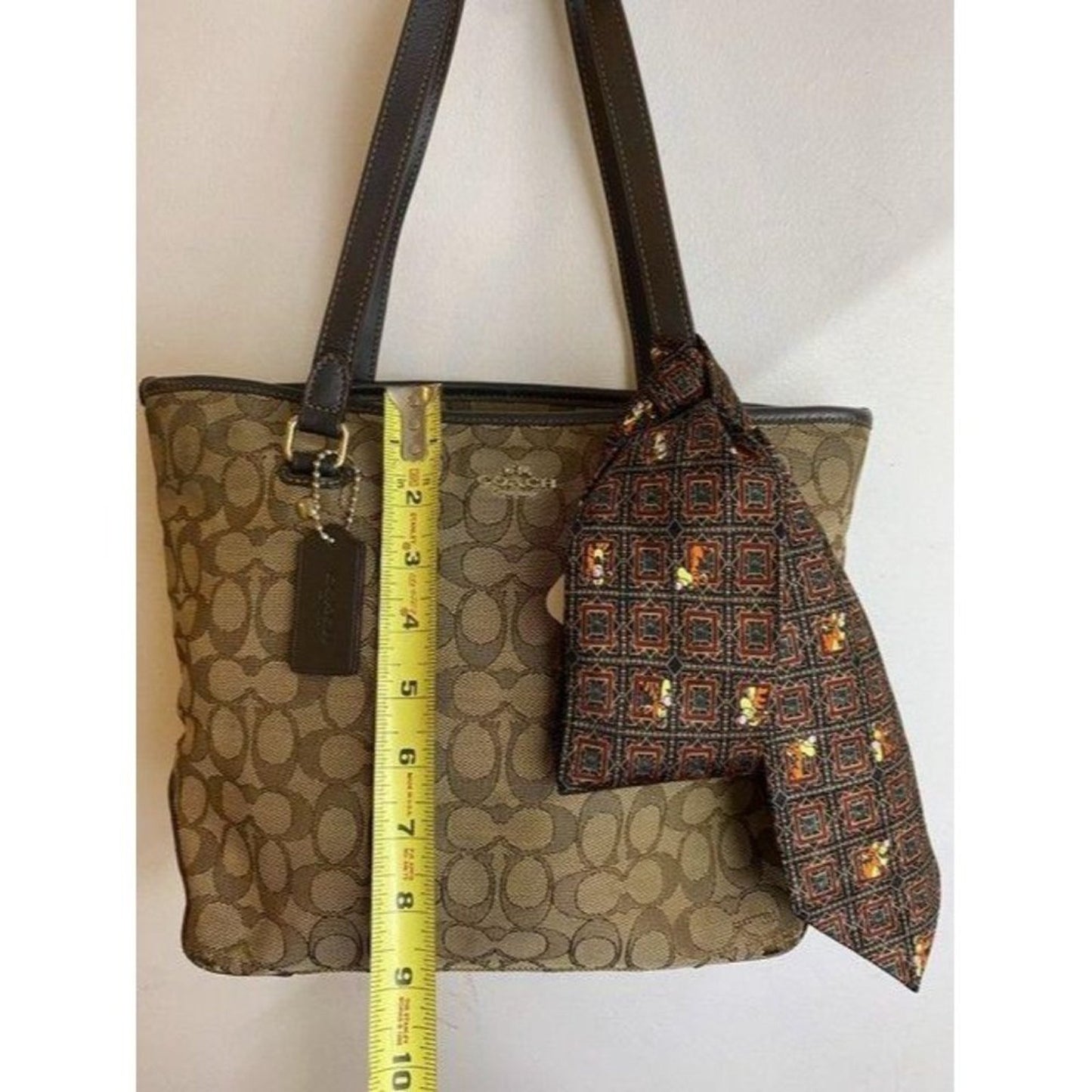 coach w all over logo w add on pooh beige brown ja