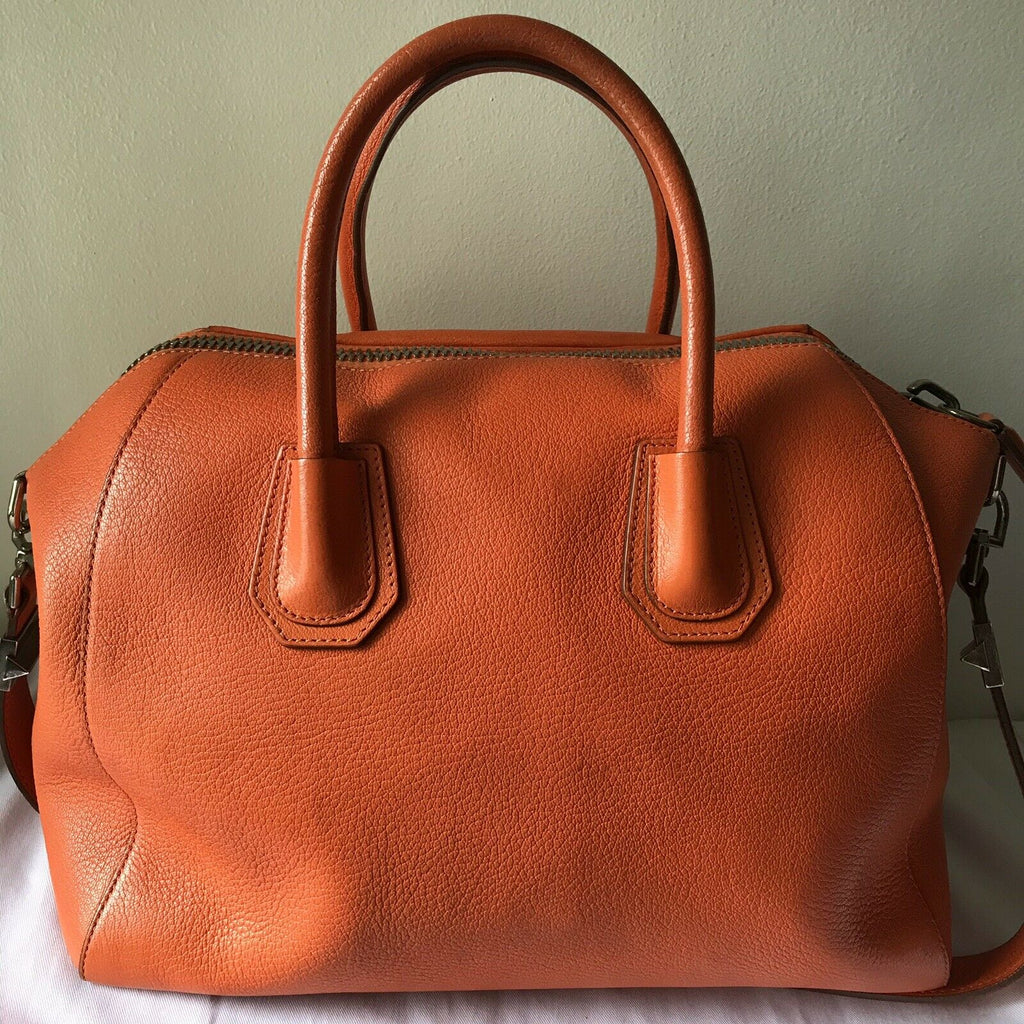 Antigona leather clutch bag Givenchy Orange in Leather - 34811557