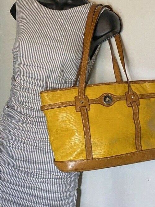 Dooney and Bourke yellow unique leather shoulder bag