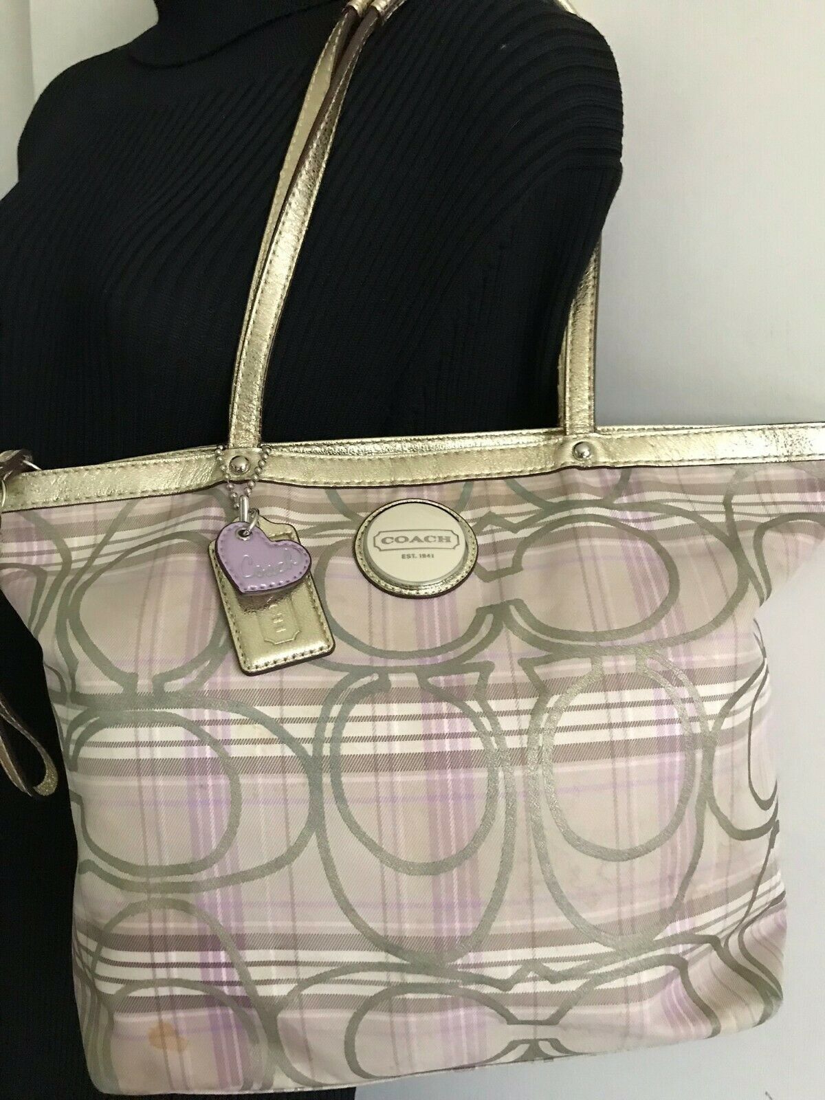 Coach stain fabric khaki tote with multi color logo design