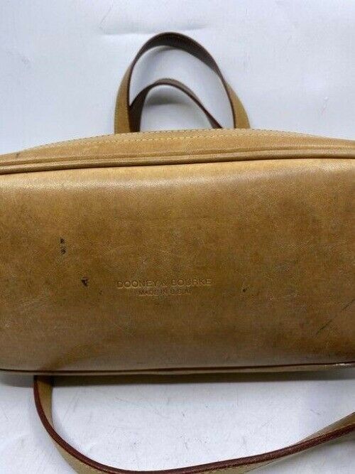 Dooney and Bourke large perforated handbag black tan leather cross body bag