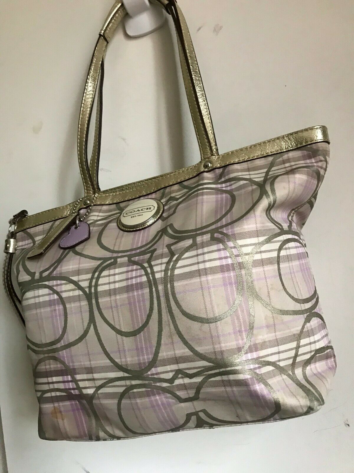 Coach stain fabric khaki tote with multi color logo design
