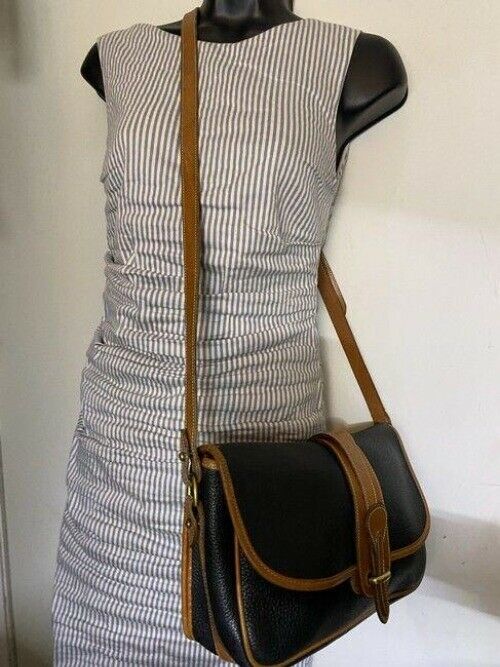 Dooney and Bourke vintage black tan leather cross body bag