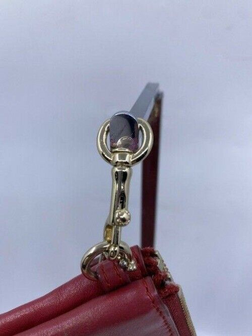 coach double needs strap red wristlet