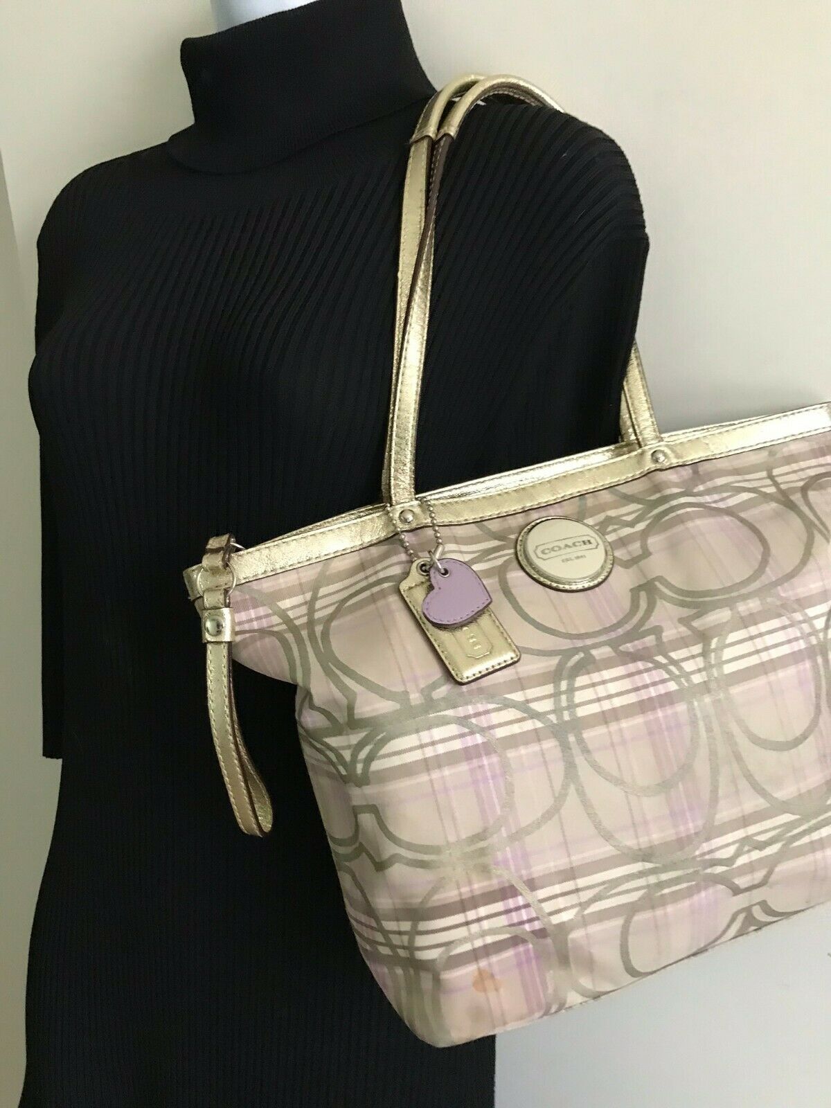 Coach stain fabric khaki tote with multi color logo design