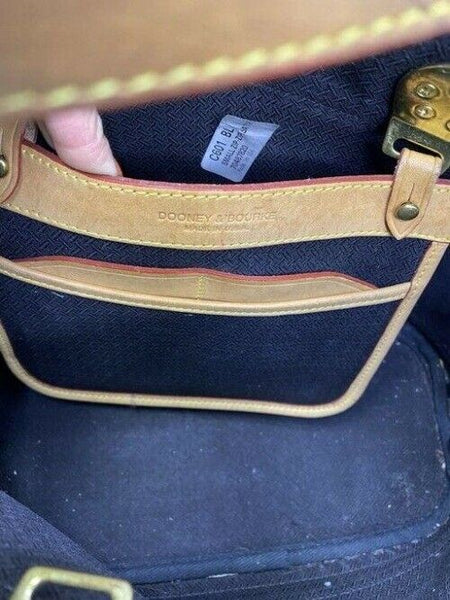 Dooney and Bourke large perforated handbag black tan leather cross body bag