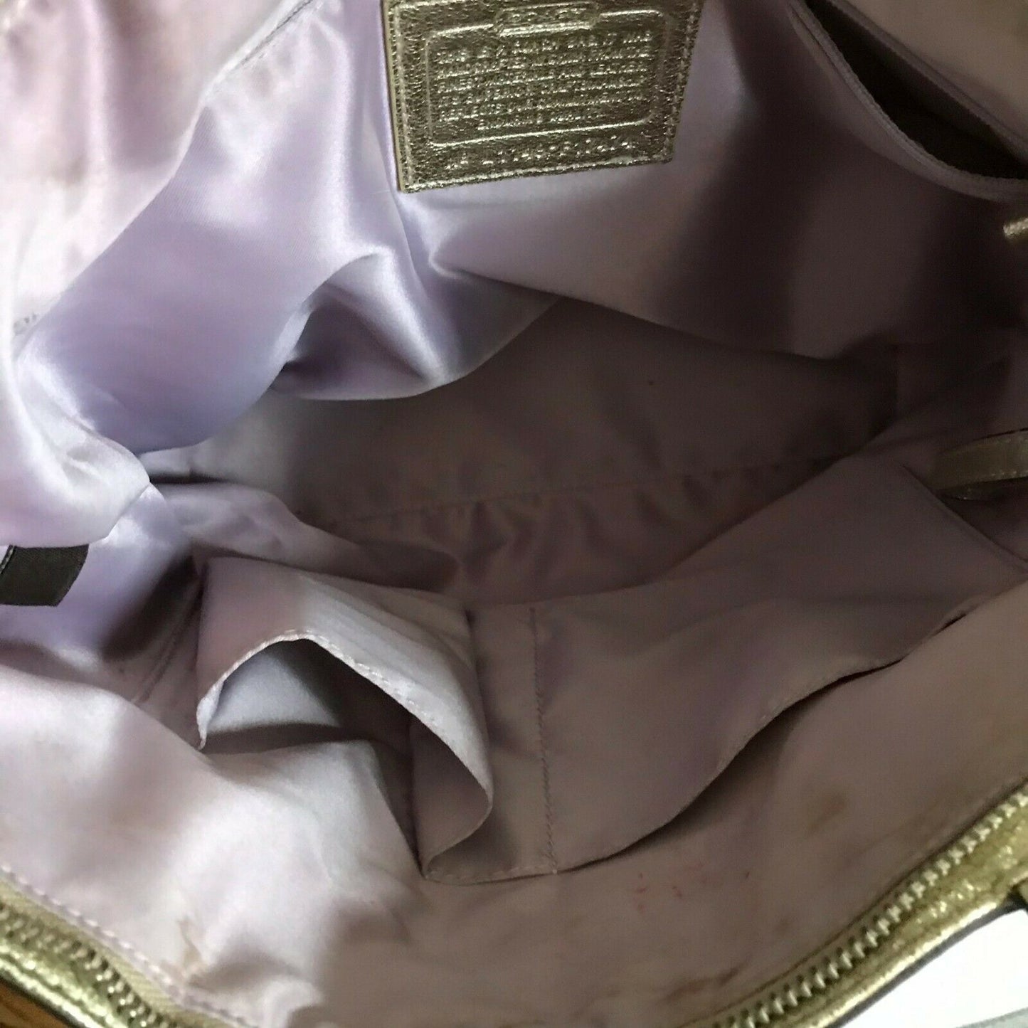 Coach stain fabric khaki tote with multi color logo design