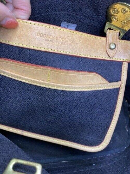 Dooney and Bourke large perforated handbag black tan leather cross body bag