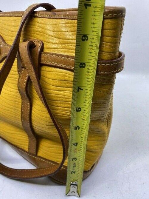 Dooney and Bourke yellow unique leather shoulder bag
