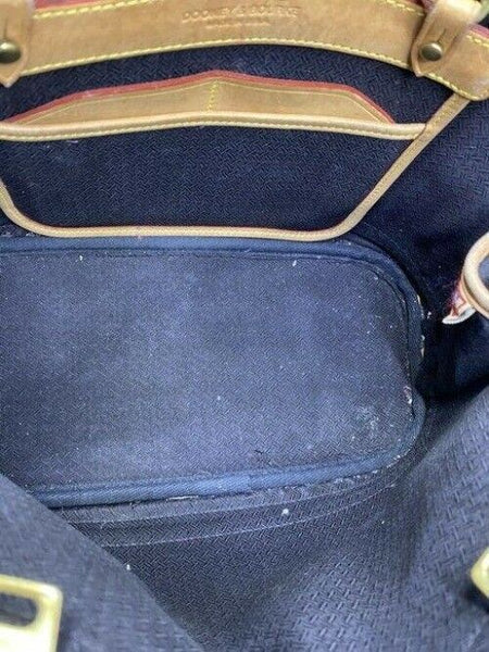 Dooney and Bourke large perforated handbag black tan leather cross body bag